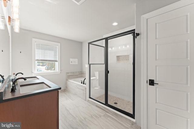 bathroom with plus walk in shower and vanity