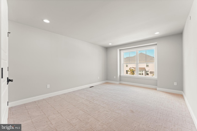 view of carpeted spare room