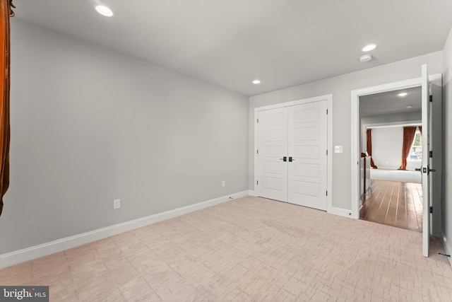 unfurnished bedroom featuring a closet