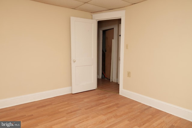 418 Center Ave, Jim Thorpe, PA 18229 - empty room with a drop ceiling, baseboards, and light wood-style floors