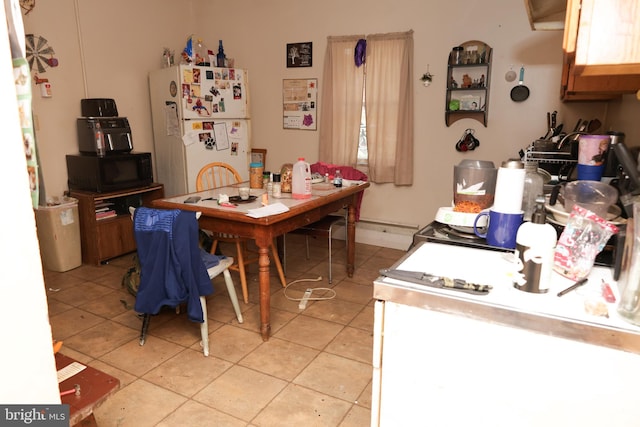 dining space with light tile patterned floors