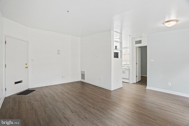 unfurnished room with dark hardwood / wood-style flooring