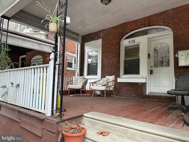 wooden terrace featuring a porch