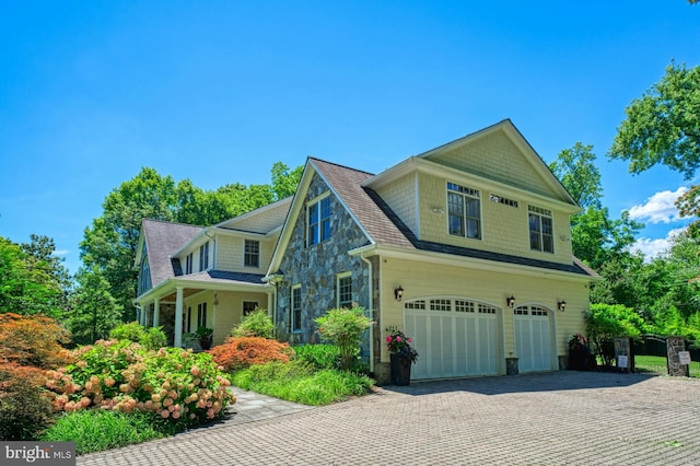 view of side of property with a garage