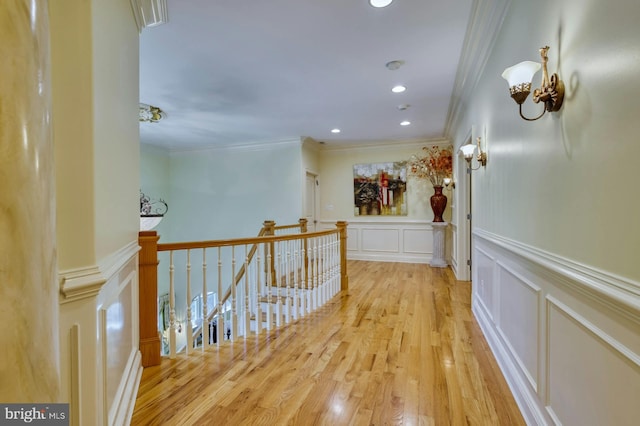 hall featuring crown molding and light wood-type flooring