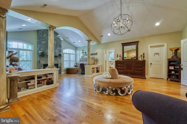 sitting room with ceiling fan, light hardwood / wood-style flooring, decorative columns, and a healthy amount of sunlight