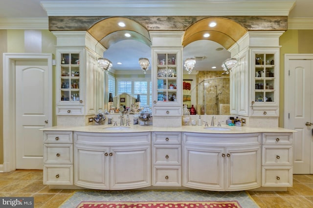 bathroom featuring ornamental molding, vanity, and walk in shower