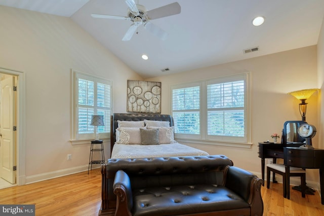 bedroom with multiple windows, light hardwood / wood-style flooring, and lofted ceiling