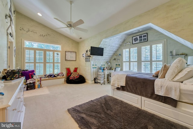 carpeted bedroom with high vaulted ceiling and ceiling fan