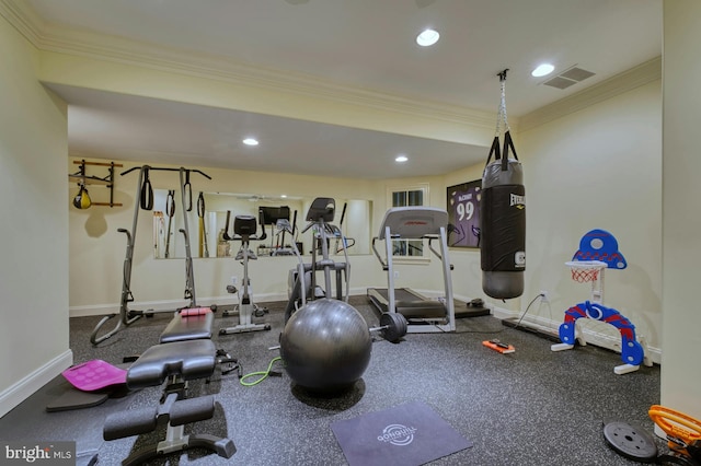 exercise room featuring crown molding