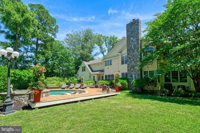 view of yard with a pool side deck