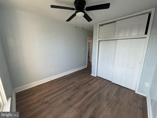 unfurnished bedroom featuring ceiling fan, a closet, and dark hardwood / wood-style floors