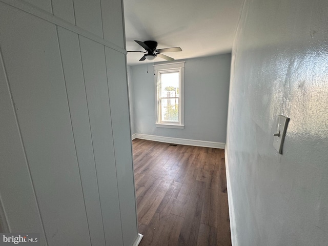 empty room with wood-type flooring and ceiling fan