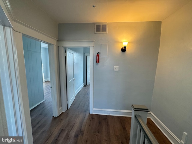 hallway featuring dark hardwood / wood-style flooring