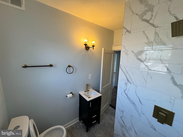 bathroom with vanity and toilet