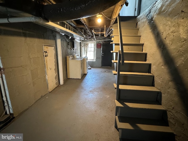 basement with washing machine and clothes dryer