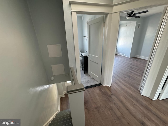 hallway with wood-type flooring