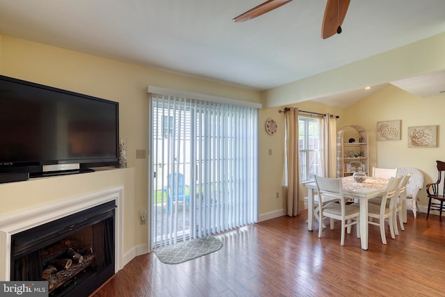 dining area with ceiling fan, hardwood / wood-style flooring, and lofted ceiling