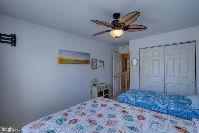 bedroom with ceiling fan and a closet