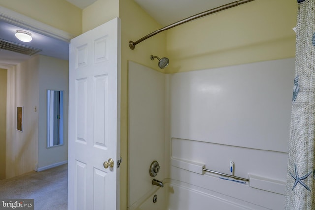 bathroom featuring shower / tub combo with curtain