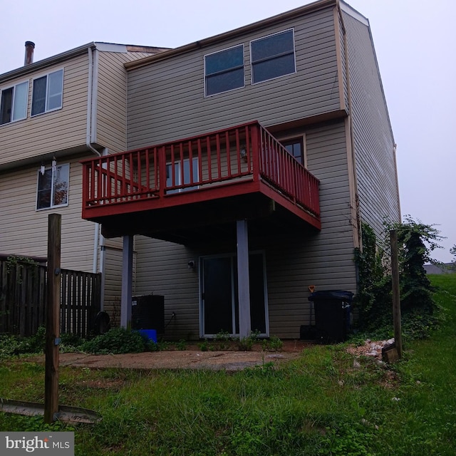 rear view of property with a yard