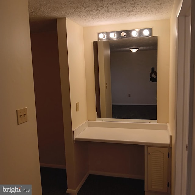 bathroom with a textured ceiling