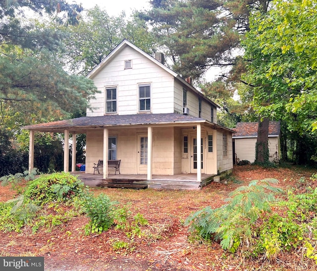 country-style home featuring covered porch