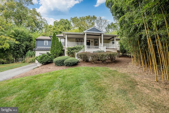 view of front of home with a front lawn and covered porch