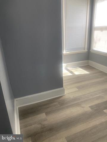 unfurnished room featuring hardwood / wood-style flooring