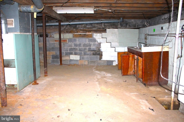 basement featuring heating unit