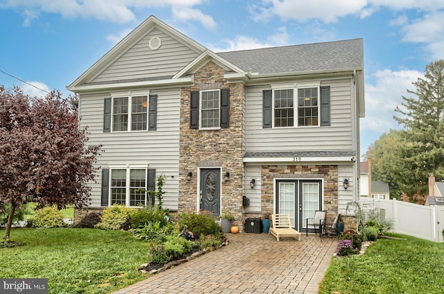 view of front of home with a front lawn and a patio area