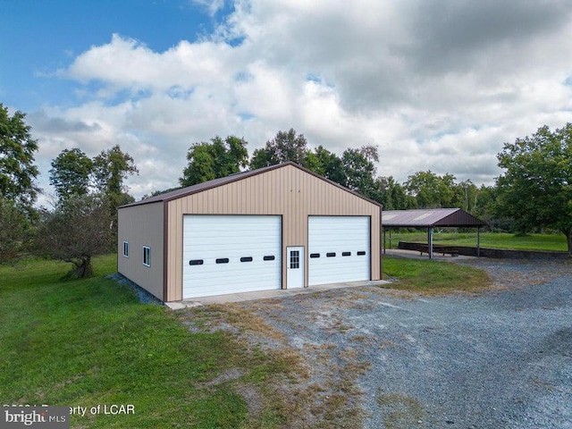 garage with a yard