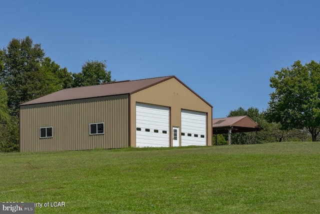 garage featuring a yard