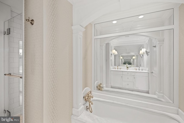 bathroom featuring vanity, plus walk in shower, and crown molding