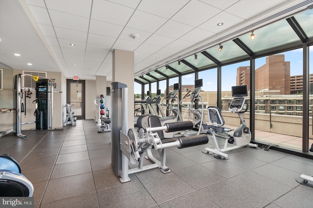 workout area with a paneled ceiling