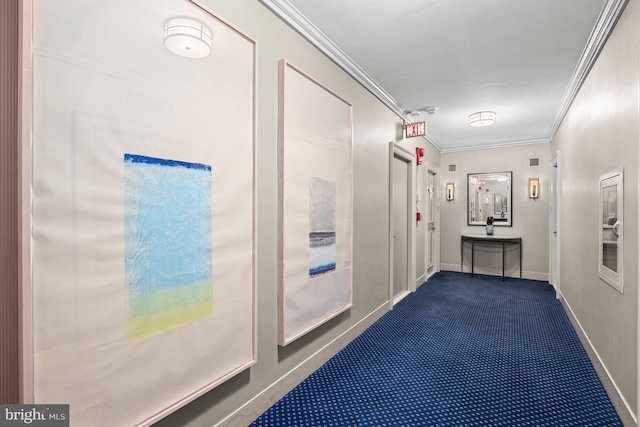 hallway with crown molding and dark colored carpet