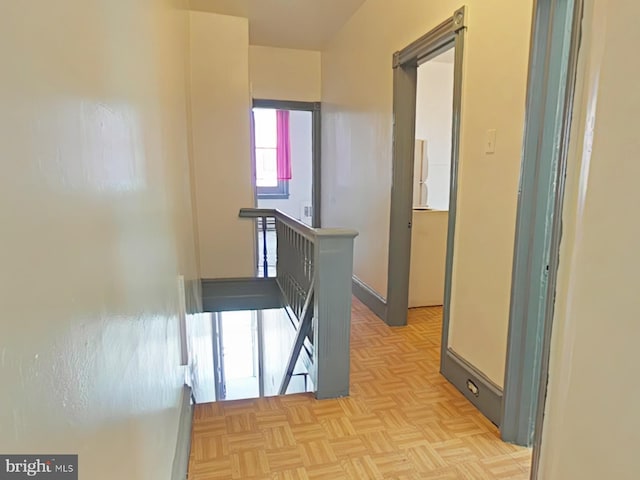 hallway featuring light parquet flooring