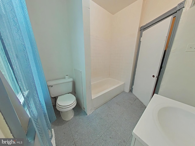 bathroom featuring walk in shower, vanity, and toilet