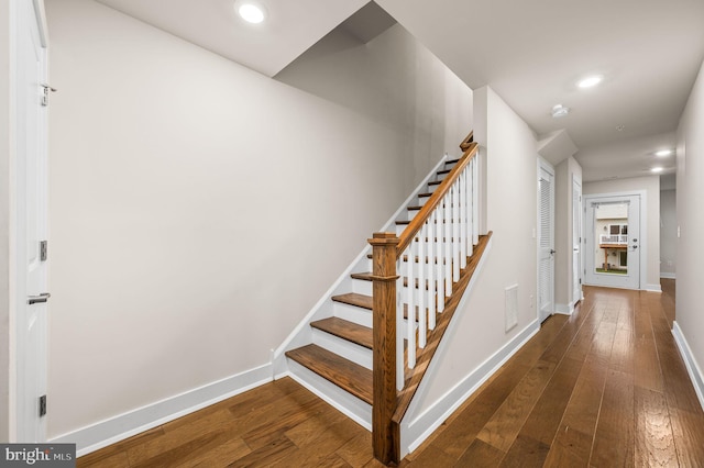 stairway featuring hardwood / wood-style flooring