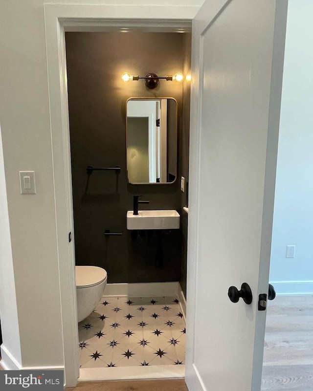 bathroom featuring sink and toilet