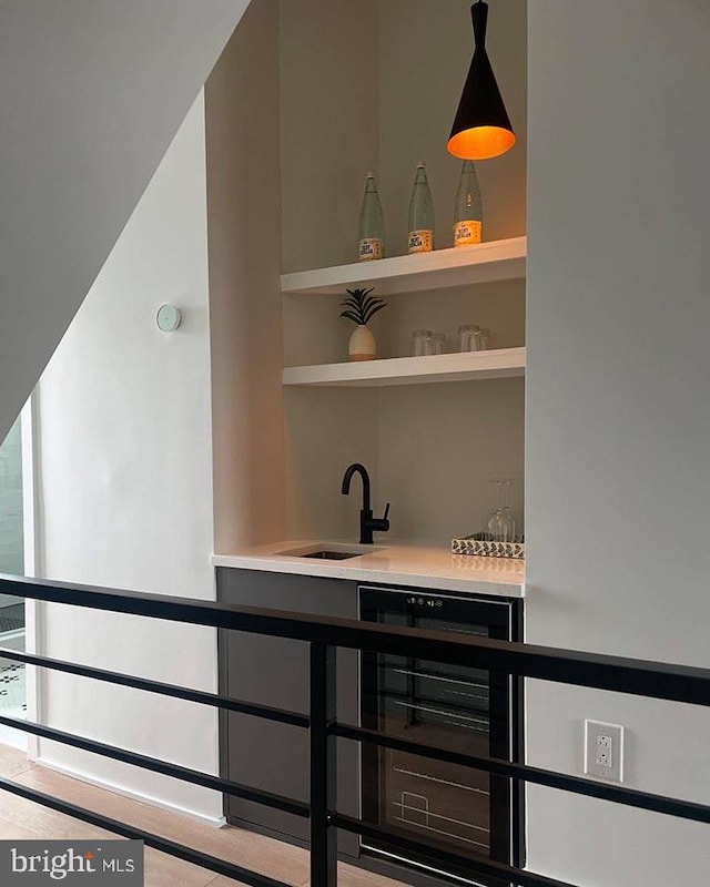 interior details featuring wet bar and beverage cooler