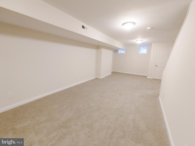 basement with light carpet