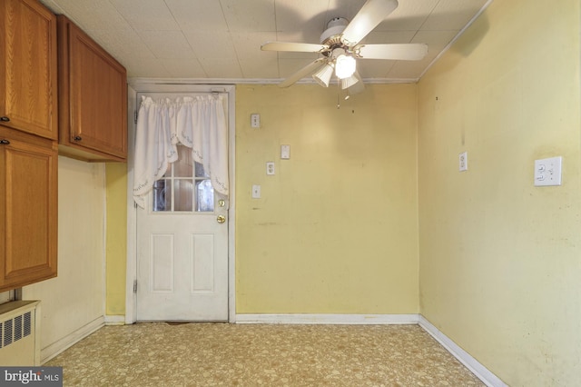 27 S St, Camden, DE 19934 - entryway with light floors, radiator heating unit, ceiling fan, and baseboards