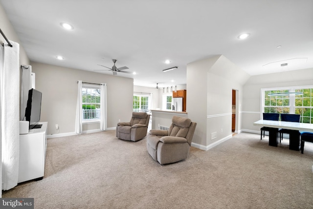 living room with light carpet and ceiling fan