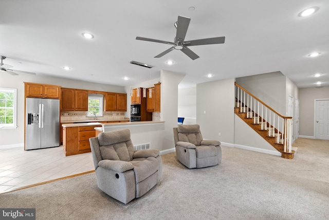 living room featuring ceiling fan and light tile patterned flooring