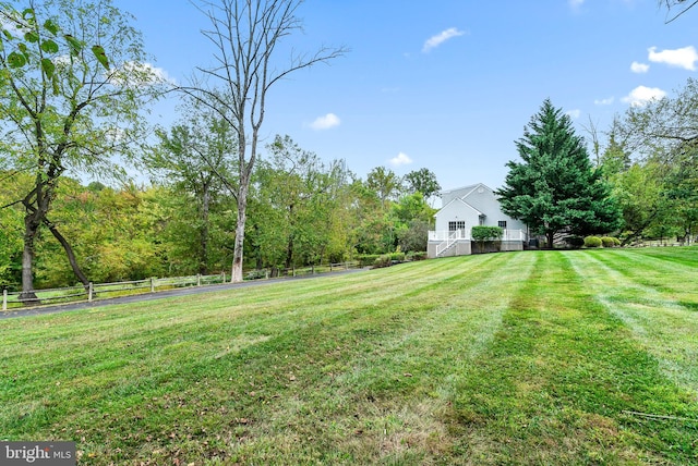 view of yard with a rural view