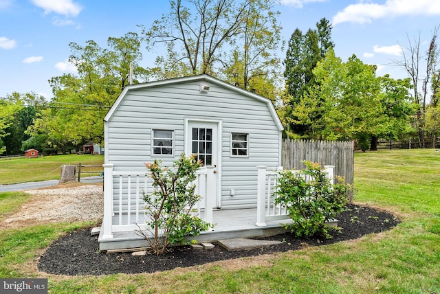 view of outbuilding with a yard