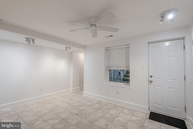 interior space featuring ceiling fan