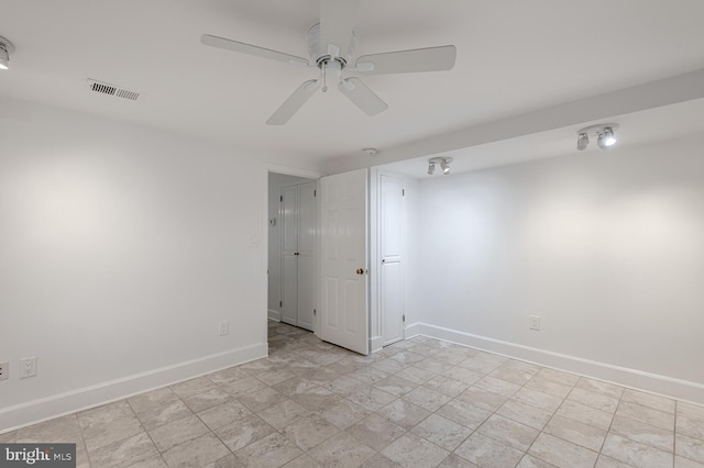 unfurnished room with ceiling fan