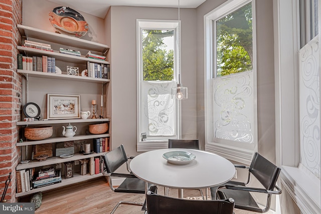 dining space with light wood-type flooring